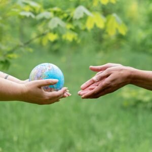 image of hands protecting an earth globe